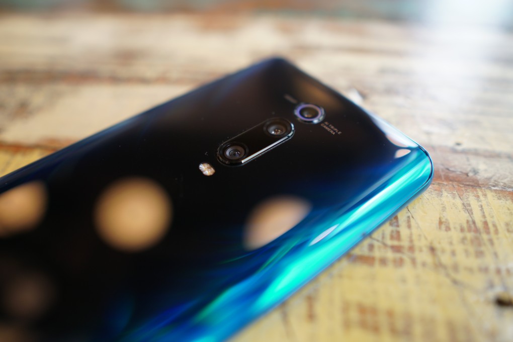 The Xiaomi Mi 9T has a triple camera system comprising a 48-megapixel sensor, a 13-megapixel wide-angle camera, and an 8-megapixel telephoto lens, housed vertically on its glass back with gradient coating. Photo: Ben Sin