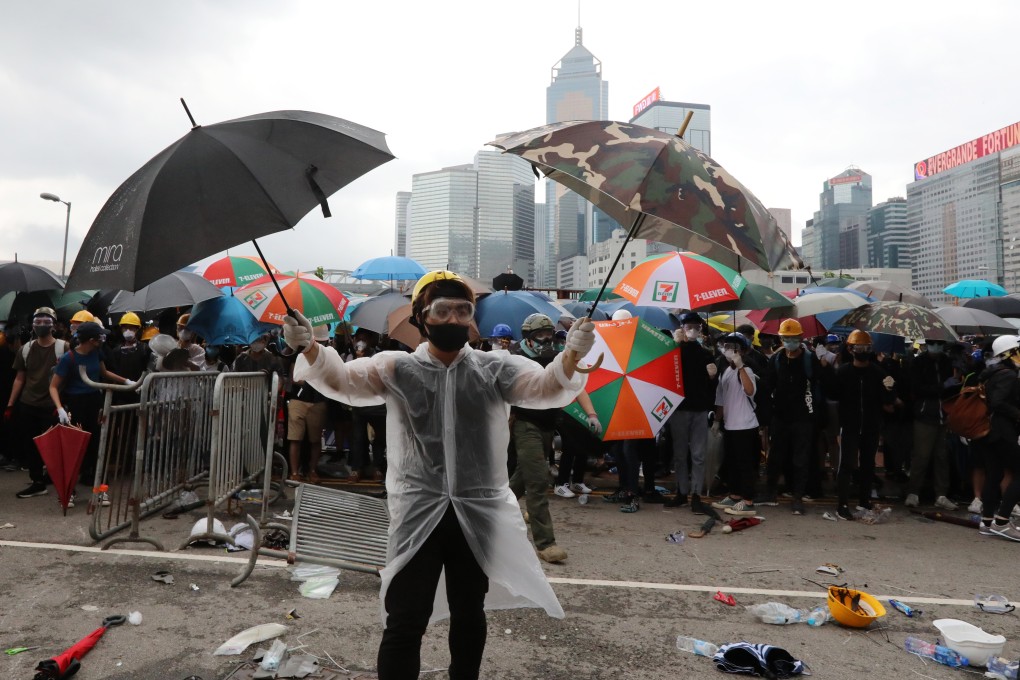 Protesters in makeshift protective gear surround Hong Kong’s legislature on June 12. Photo: Felix Wong
