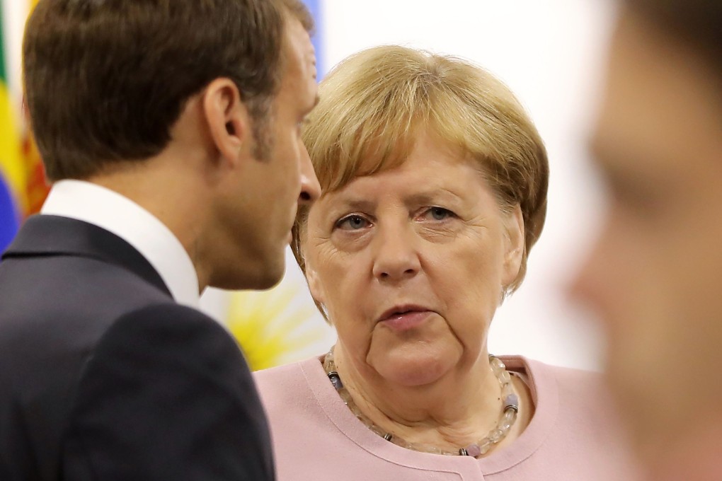 French President Emmanuel Macron talks to German Chancellor Angela Merkel at the G20 summit on Saturday. After a leaders’ declaration was signed, Merkel said they had “succeeded after days and nights of negotiation”. Photo: AFP