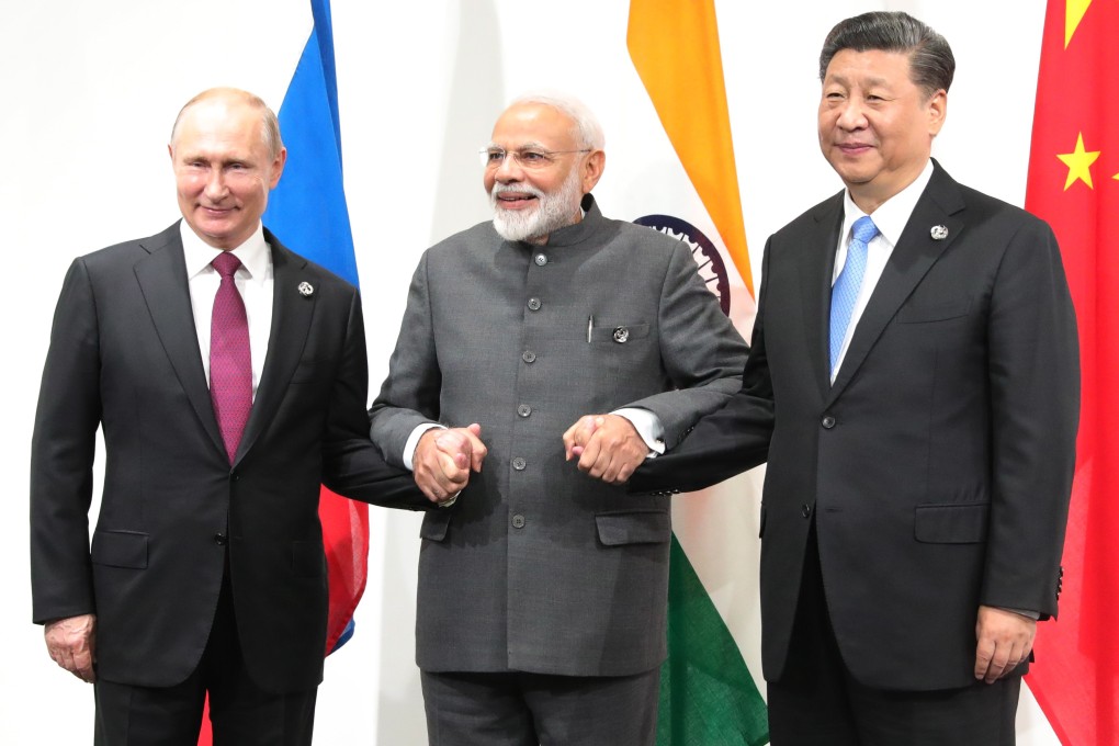 (From left) Russian President Vladimir Putin, Indian Prime Minister Narendra Modi and Chinese leader Xi Jinping meet on the sidelines of the G20 summit in Osaka, Japan, on Friday. Photo: EPA-EFE