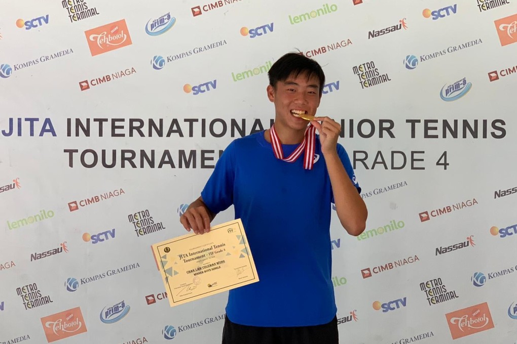 Coleman Wong bites his gold medal after winning the boy’s singles title in Jakarta. Photo: Handout