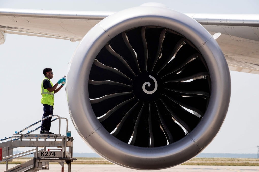 An airport worker checks the engine of a Boeing 787. File photo: AFP