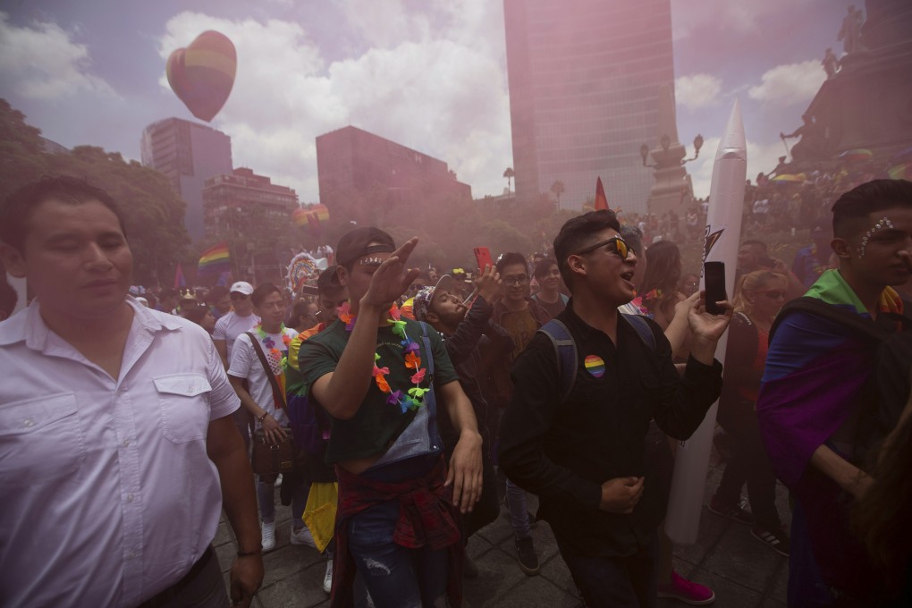 Revellers dance during the gay pride parade in Mexico City. Photo: AP Photo