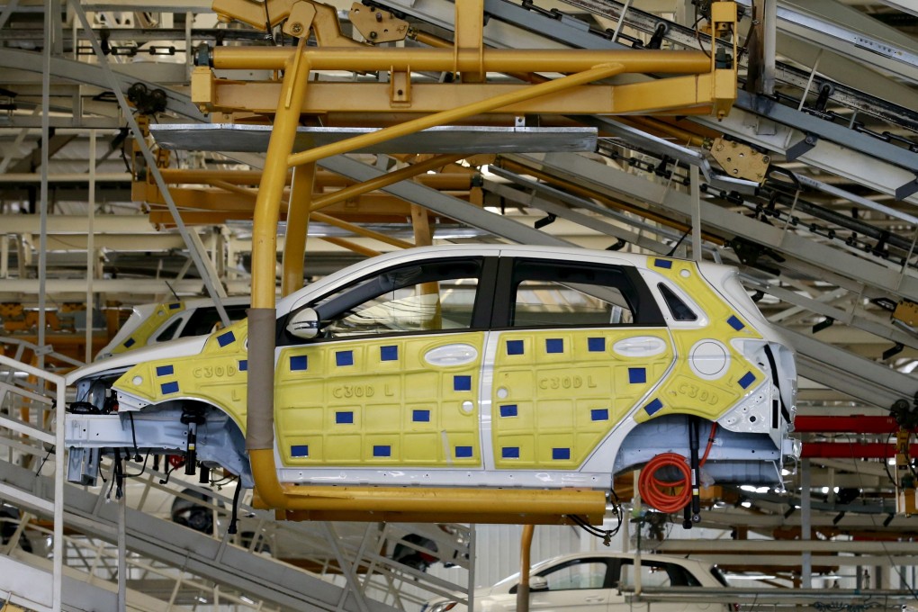 An assembly line producing electric vehicles (EV) is seen at a factory of Beijing Electric Vehicle, funded by Beijing Automotive Group (BAIC), in Beijing on January 18, 2016. Photo: Reuters