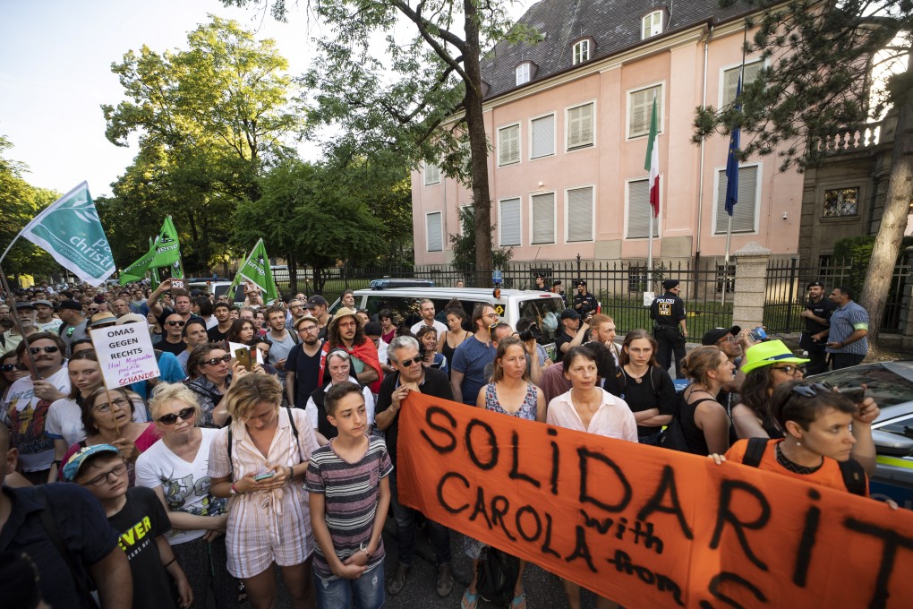 Demonstrators protest against the arrests of the captain of the migrant rescue ship in front of the Italian consulate in Munich. Photo: EPA-EFE