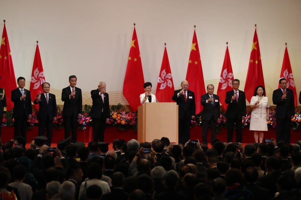 Chief Executive Carrie Lam toasts the audience during the flag-raising ceremony. Photo: Nora Tam