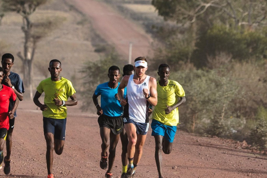 Tom Evans with the group of elite Ethiopian runners in a high-tempo training session. Photos: Max Willcocks
