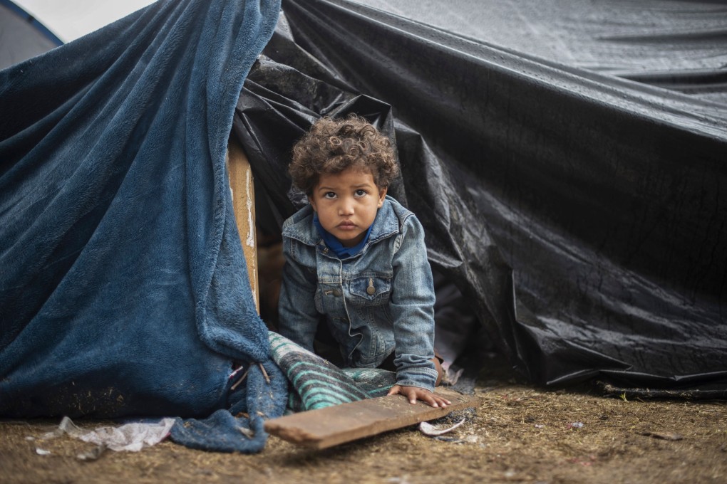 A Central American migrant child at a temporary shelter in Tijuana, Mexico. File photo: AFP
