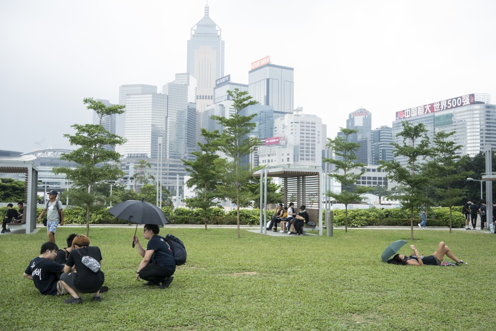 Protesters rest in Tamar Park in front of government quarters on June 17, the morning after a peaceful rally in Hong Kong. Photo: Bloomberg