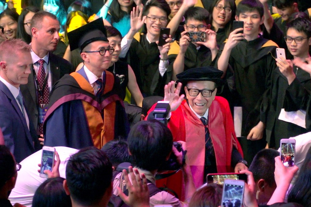 Li Ka-shing waves to the crowd at the Shantou University graduation ceremony in June 2018, as his son Richard Li Tzar-kai follows close behind. The Hong Kong tycoon has given more than HK$10 billion to the university he co-founded in his hometown. Photo: Thomas Yau