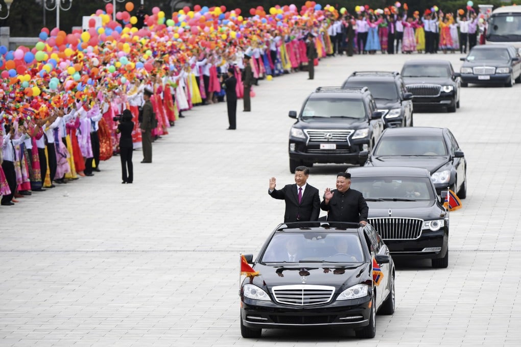 Visiting Chinese President Xi Jinping alongside North Korean leader Kim Jong-un in a limousine near the Kumsusan Palace of the Sun in Pyongyang, North Korea. Photo: AP