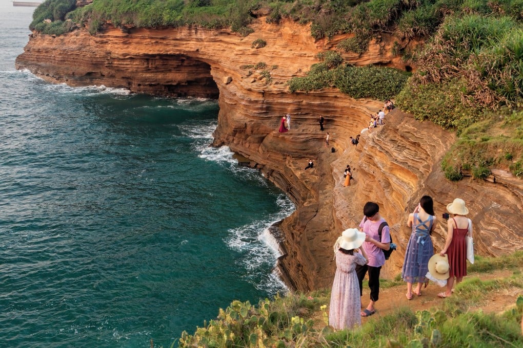 Tourists admire cliffs near Zhongmu village, Weizhou Island, China. The volcanic island offers a variety of historical, natural and geological sights. Nearby Beihai, a former treaty port, also has its charms. Photo: Martin Williams