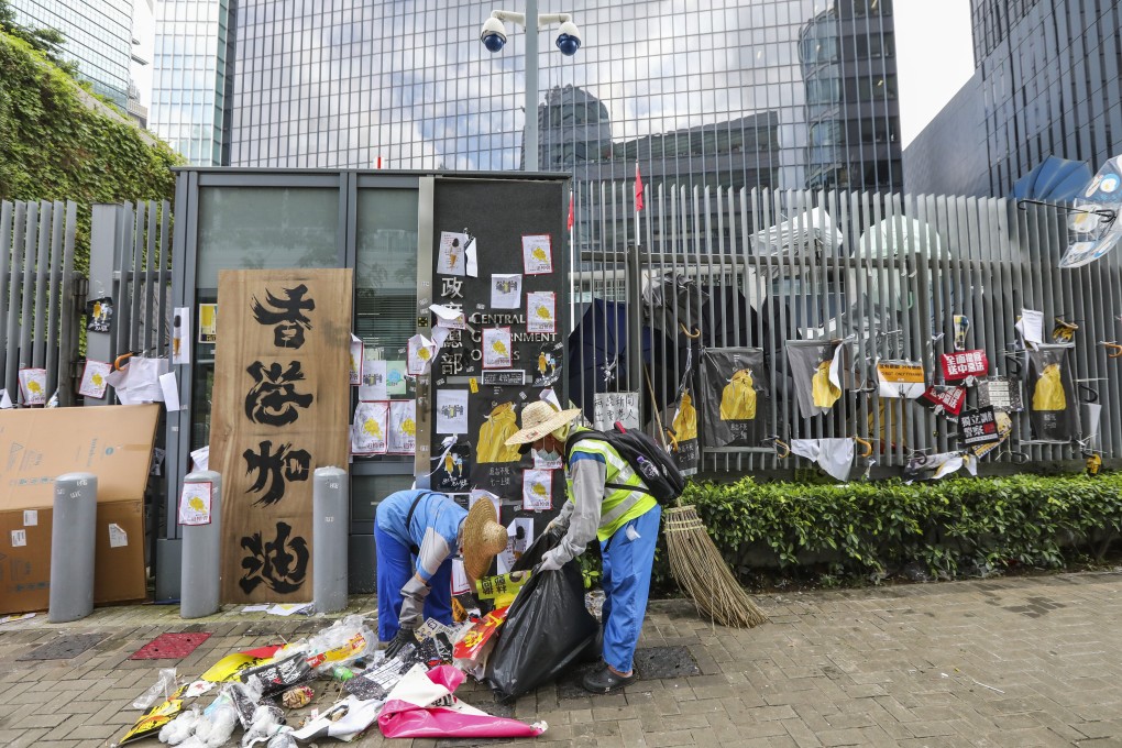 Hong Kong’s Legislative Council complex was left vandalised after protesters stormed the chamber during a protest against an extradition bill. Here, workers clean up. Photo: Felix Wong