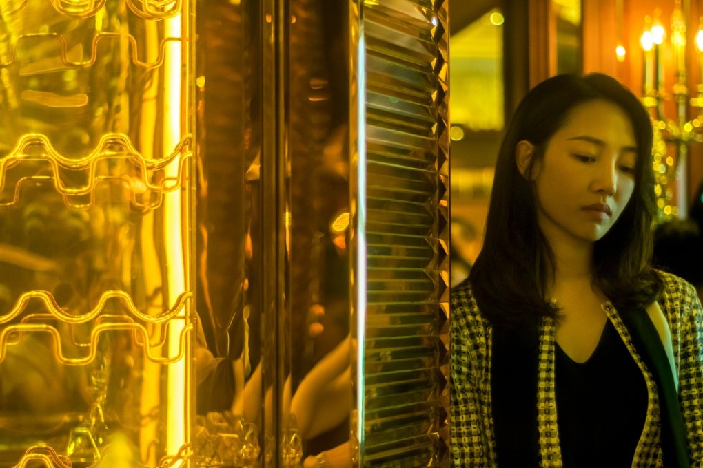 Bai Baihe in a still from A City Called Macau (category IIA; Mandarin, Cantonese), directed by Li Shaohong. Wu Gangand Huang Jue co-star.