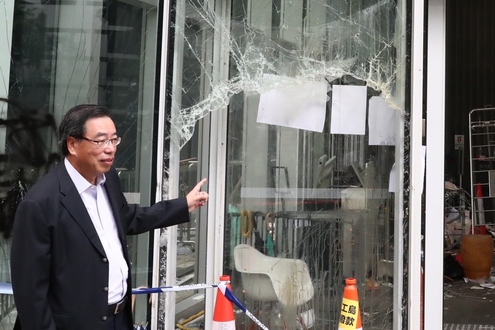 Andrew Leung, president of the Legislative Council, inspects the damage to the Legco building on Tuesday. Photo: Nora Tam