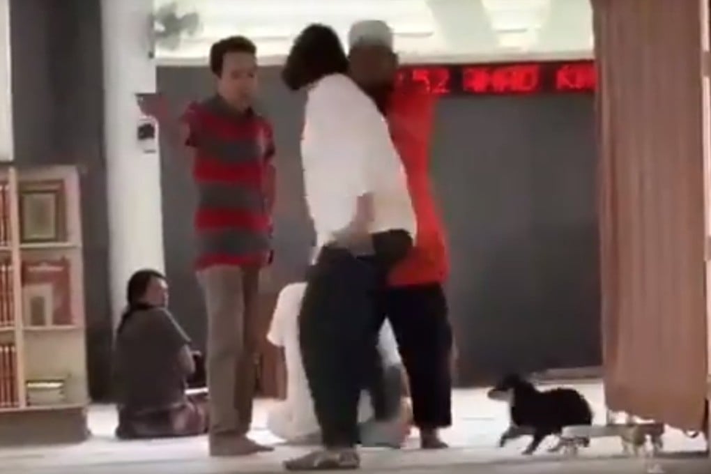 A still from the video showing the dog and the woman in the mosque. Photo: YouTube