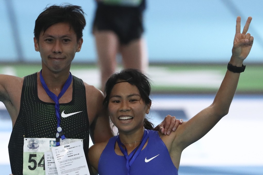 Christy Yiu Kit-ching with husband Chan Ka-ho after winning the women's half marathon at the Standard Chartered Hong Kong Marathon in February. Photo: Nora Tam