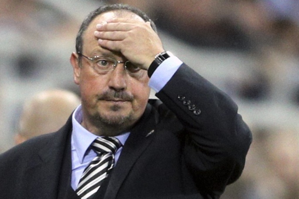 Newcastle United manager Rafael Benitez watches an English League Cup match against Nottingham Forest. Photo: AP