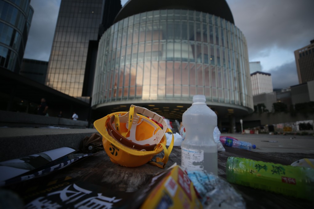 Helmets, bottles and umbrellas are all left behind after protesters end their occupation of the Legislative Council. Photo: Winson Wong