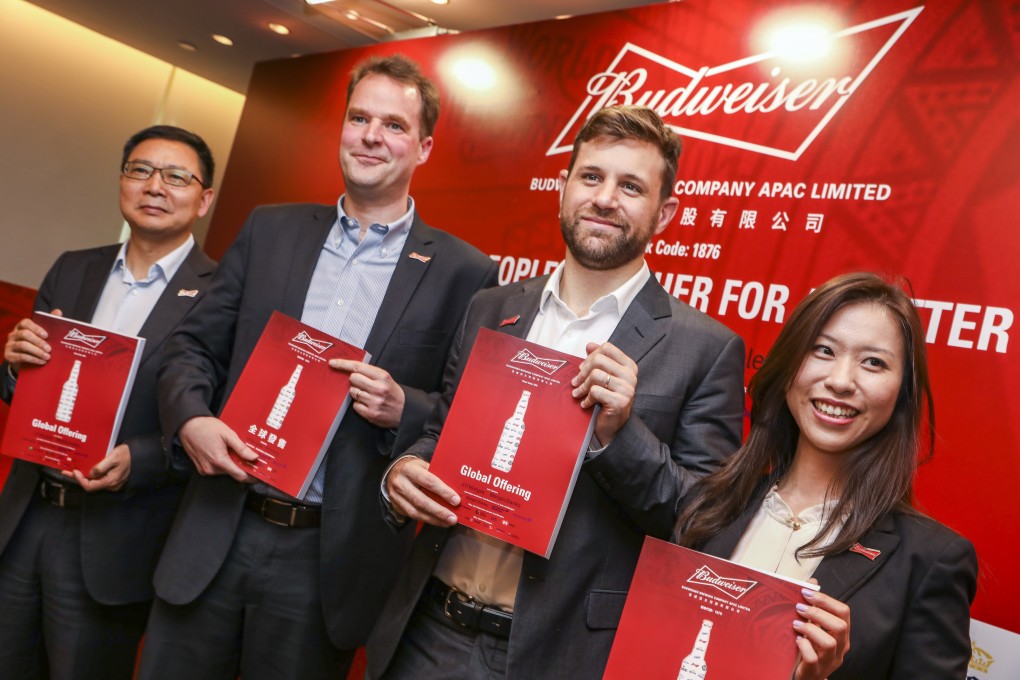 (From left) Frank Renrong Wang, executive director of Budweiser Brewing Company APAC, CEO Jan Craps, CFO Gui Castellam and head of investor relations Heidi Li, at the company’s press conference to announce the IPO. Photo: K. Y. Cheng