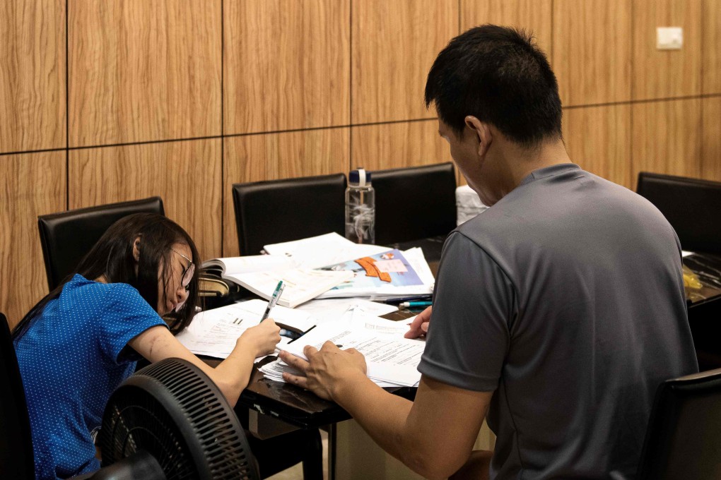 A student studying with a tutor from her home in Singapore. Photo: AFP