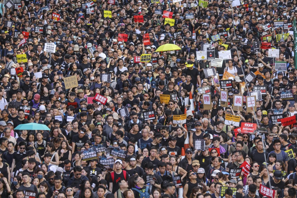 Protesters take to the streets on the 22nd anniversary of Hong Kong's handover from Britain to China. Photo: Dickson Lee