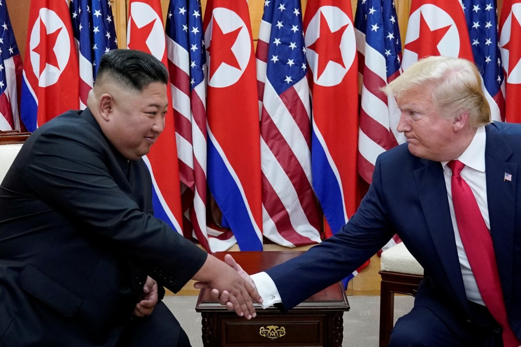 US President Donald Trump shakes hands with North Korean leader Kim Jong-un as they meet at the demilitarised zone separating the two Koreas on Sunday. Photo: Reuters