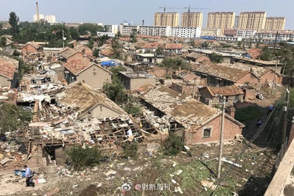 Residents try to pick up the pieces after a deadly tornado destroyed homes and factories in Kaiyuan, Liaoning province, on Wednesday afternoon. Photo: Weibo