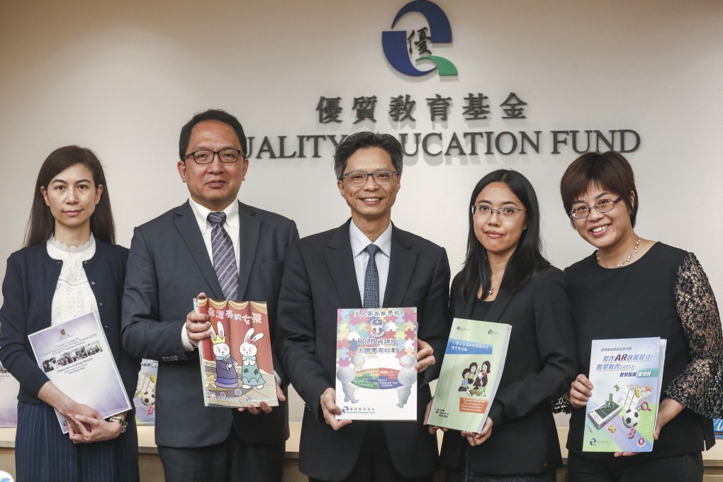 Officials including Gordon Tsui (centre) and Wendy Au (second right) unveil the priority themes for the Quality Education Fund. Photo: Jonathan Wong