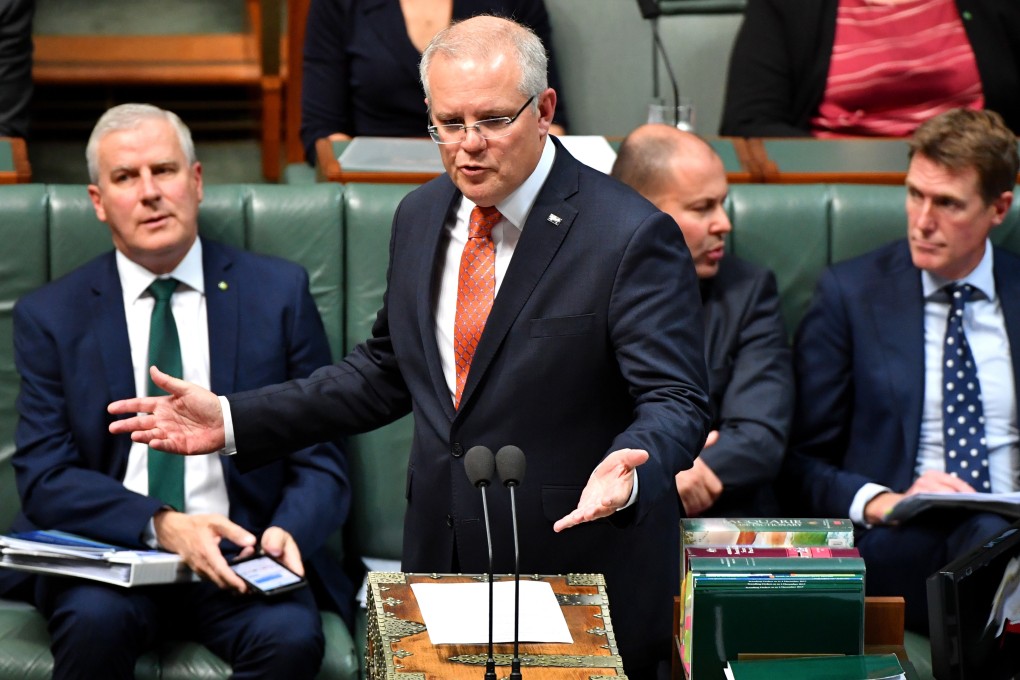 Prime Minister Scott Morrison speaks at the dispatch box in the House of Representatives at Parliament House in Canberra. Photo: EPA