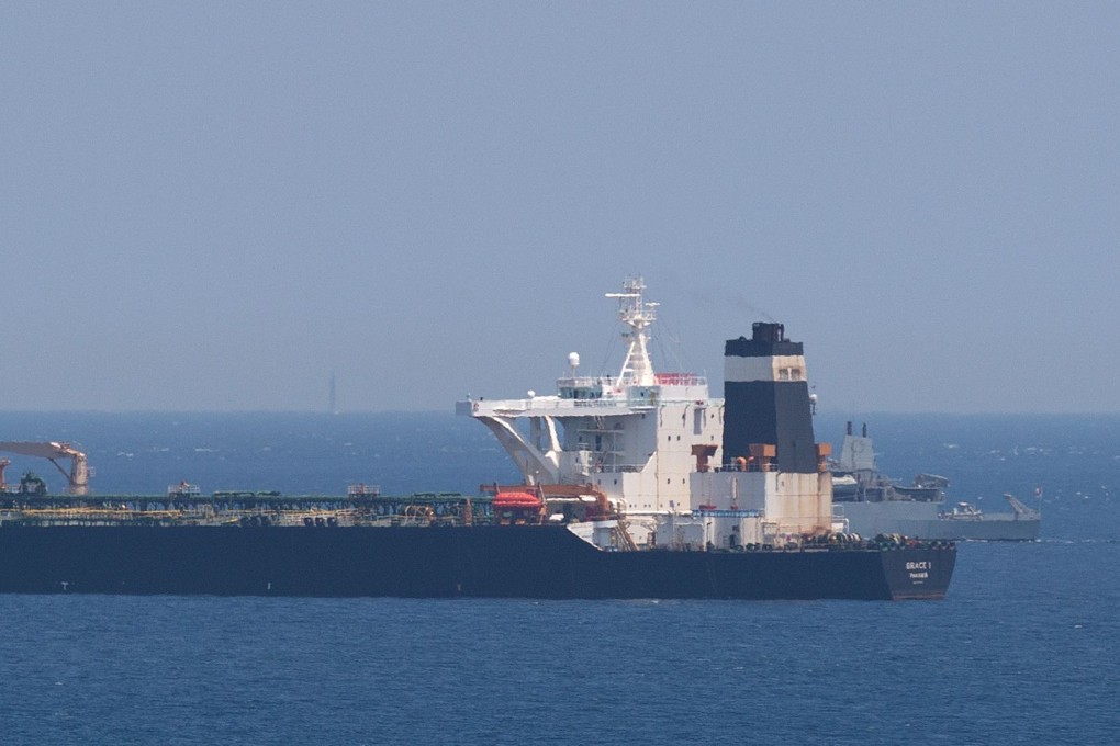 A British Royal Navy ship patrols near supertanker Grace 1 suspected of carrying crude oil to Syria. Photo: AFP