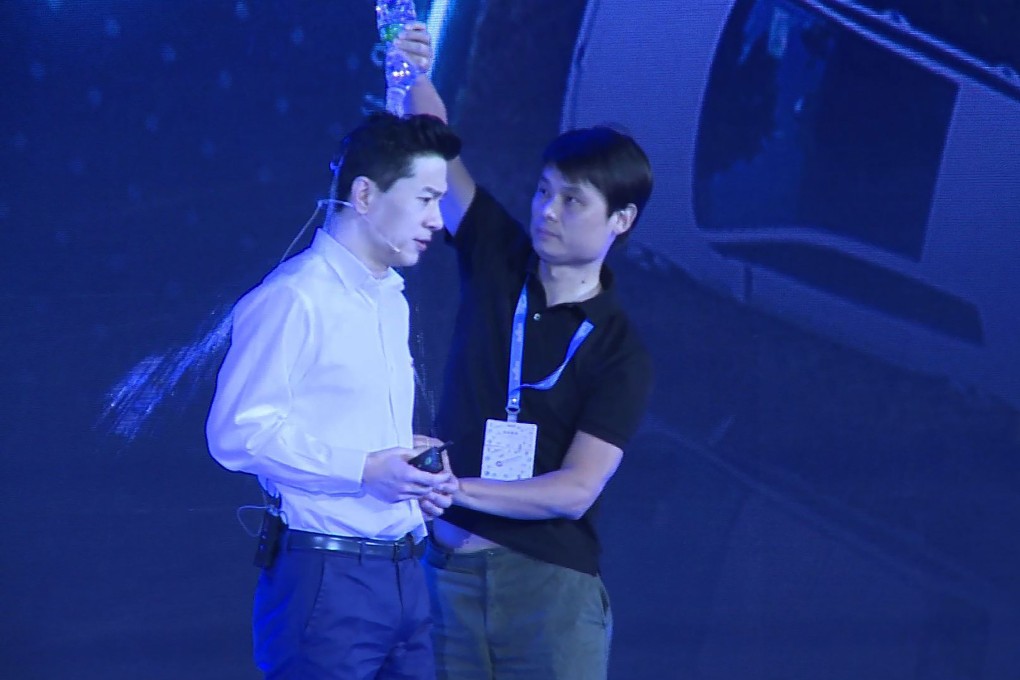 A man pours water over Baidu co-founder and CEO Robin Li during Baidu Create 2019 in Beijing on July 3. Photo: AFP