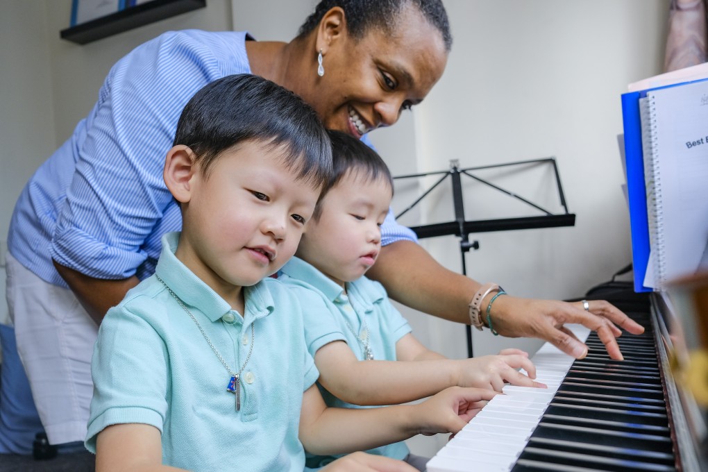 Charliah Best (in blue shirt), director of Best Music Academy in Hong Kong, teaching music to brothers Zachary, 4, (left) and Cameron, 3, in Causeway Bay. She says the positive impact music has on the kids’ emotional, social and physical well-being is evident. Photo: Tory Ho