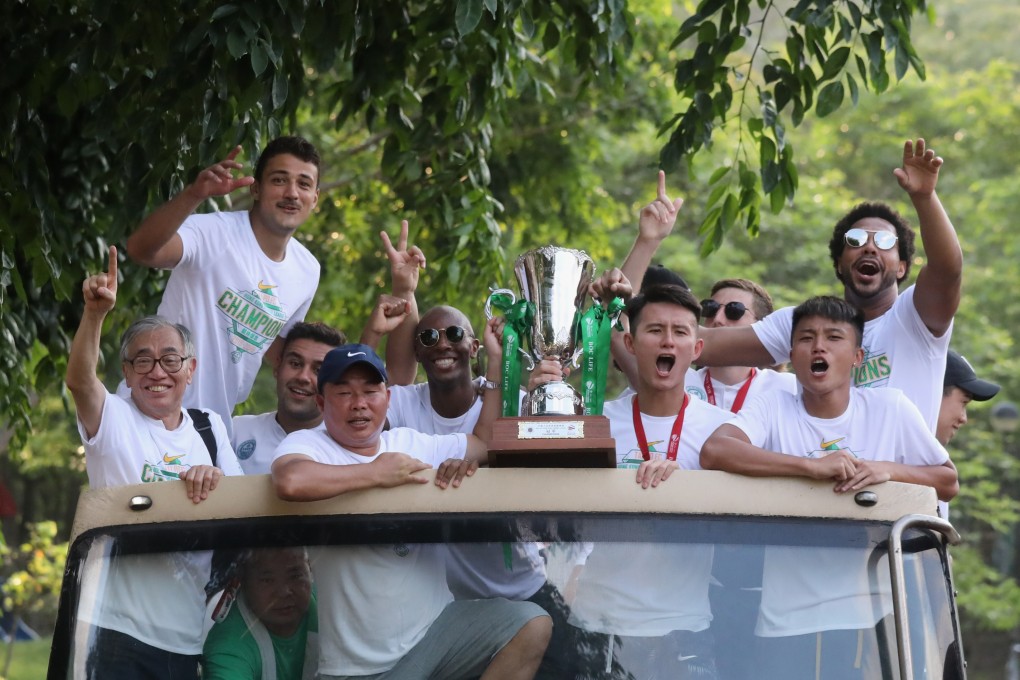 The Wofoo Tai Po team celebrate their title during a bus parade through the district. Photo: SCMP/K. Y. Cheng