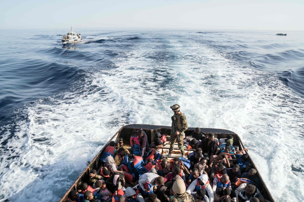 In this file photo taken on June 27, 2017 a Libyan coast guardsman stands on a boat during the rescue of 147 illegal immigrants attempting to reach Europe. Photo: Agence France-Presse