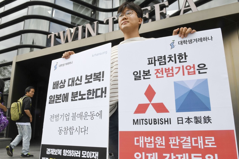 A man protests against Japan’s decision to restrict exports outside the Japanese embassy in Seoul. Photo: Kyodo