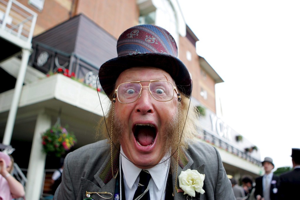 John McCririck poses for the camera at the first day of the Royal Ascot meeting in York, Britain, 14 June 2005. Photo: EPA-EFE