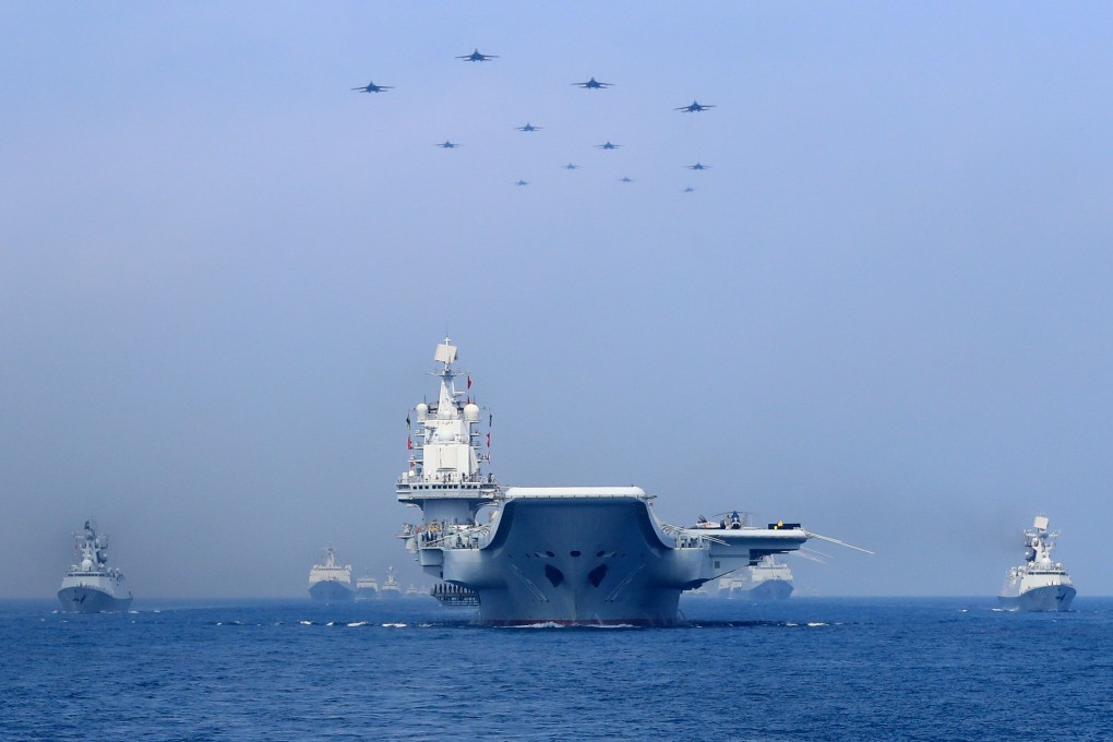 Chinese People's Liberation Army Navy warships and planes take part in a military display in the South China Sea in April. Photo: Reuters