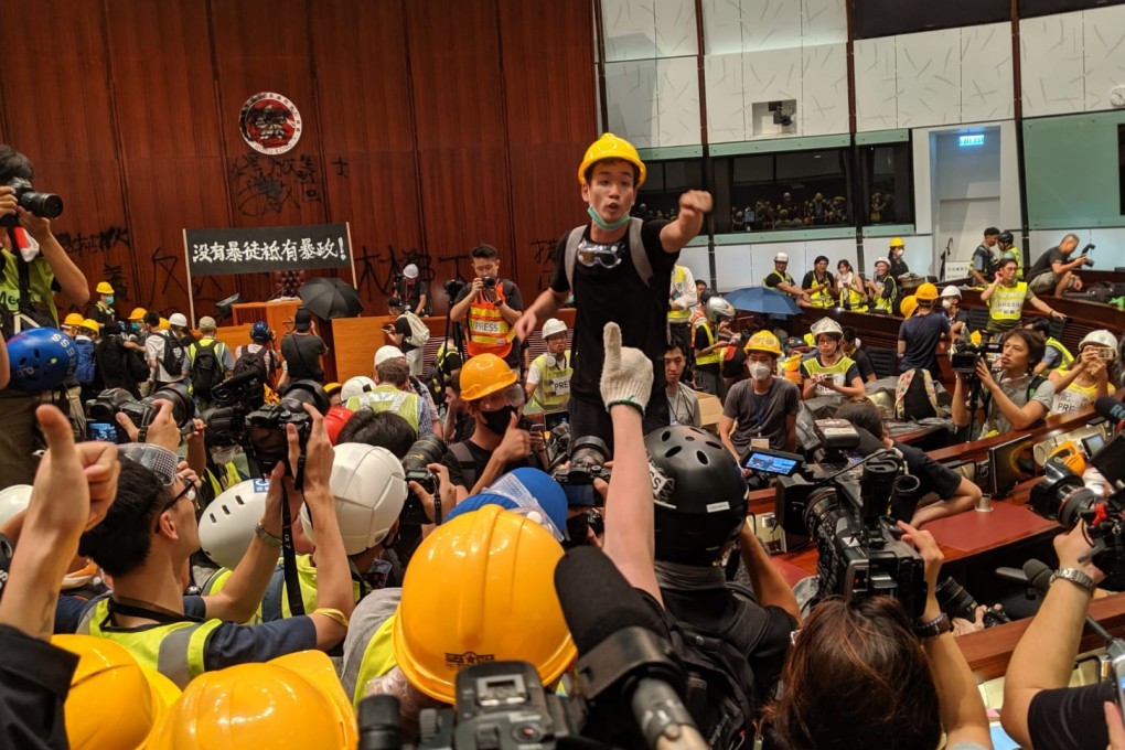 Brian Leung pleads with protesters who have stormed the Legco chamber to stay. Photo: Sum Lok-kei