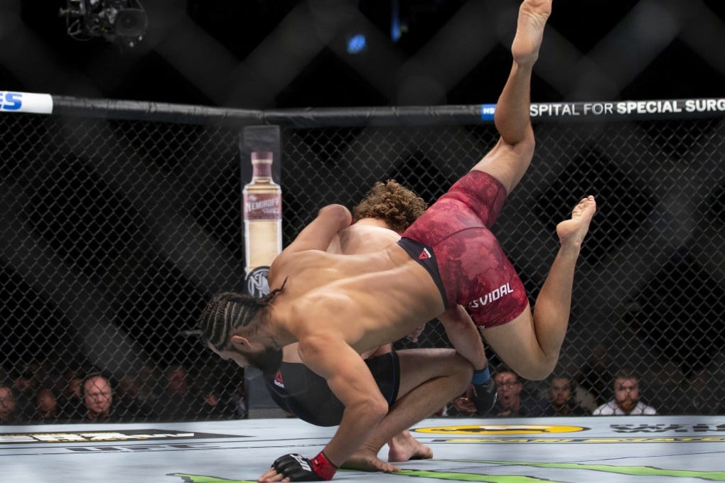 Jorge Masvidal, lands a flying knee on Ben Askren at the start of their welterweight bout at UFC 239. Photo: AP
