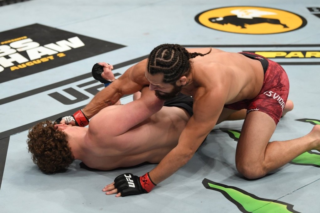 Jorge Masvidal lands a couple of punches on Ben Askren after knocking him out cold with a flying knee. Photo: UFC/Twitter