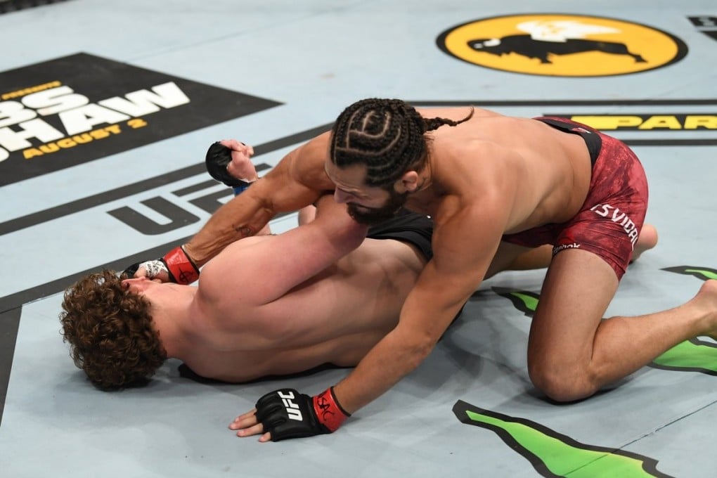Jorge Masvidal lands a couple of punches on Ben Askren after knocking him out cold with a flying knee. Photo: UFC/Twitter