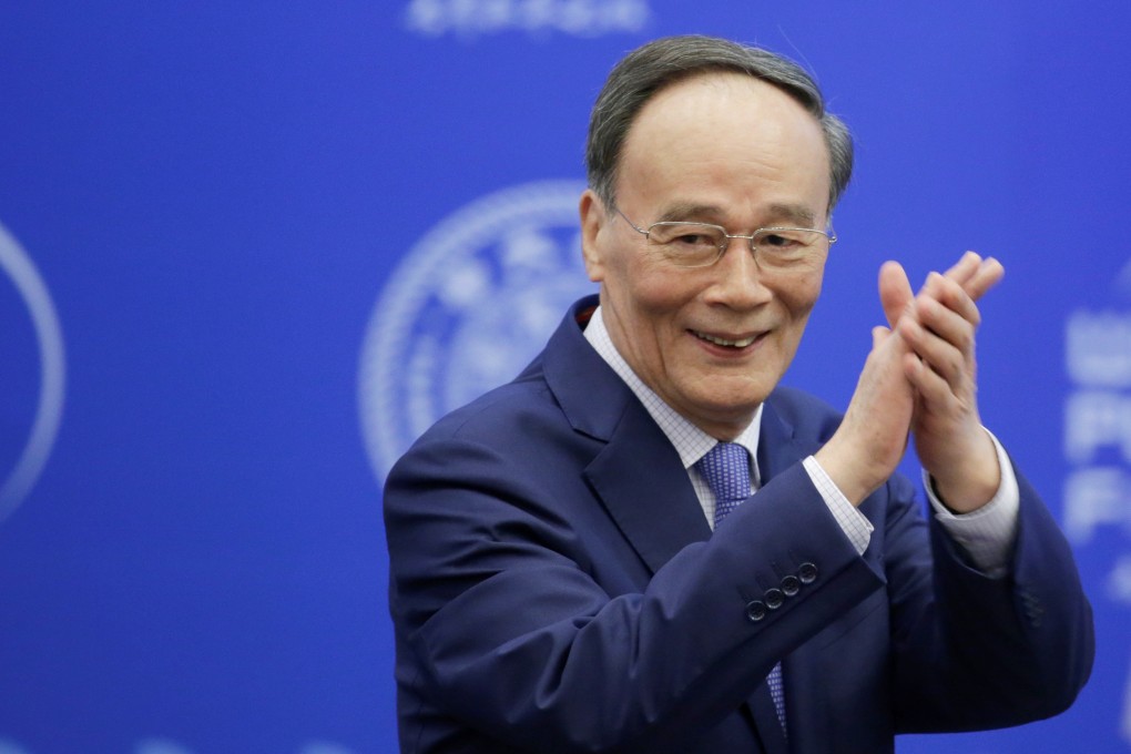 Wang Qishan arrives to attend the World Peace Forum in Beijing on Monday. Photo: Reuters