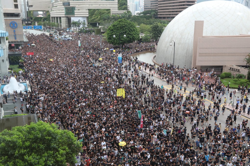 Protesters march along Tsim Sha Tsui in the latest protest, a largely peaceful one, against the extradition bill. Photo: Felix Wong