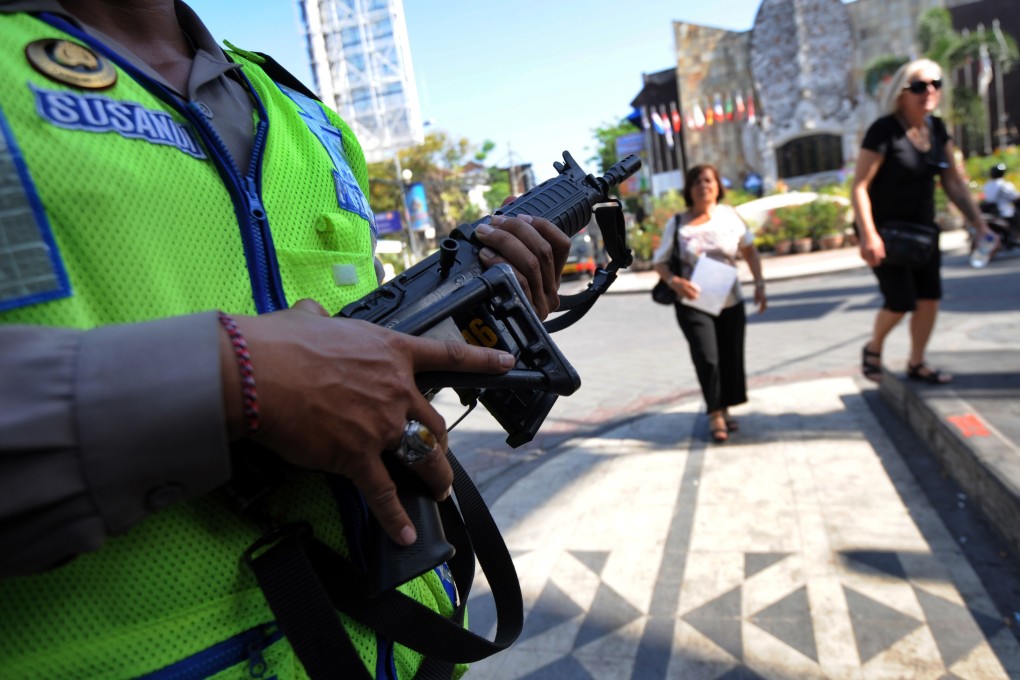 An Indonesian policeman stands guard near the memorial monument for victims of the 2002 Bali bombings, which were carried out by Jemaah Islamiah. Photo: AFP
