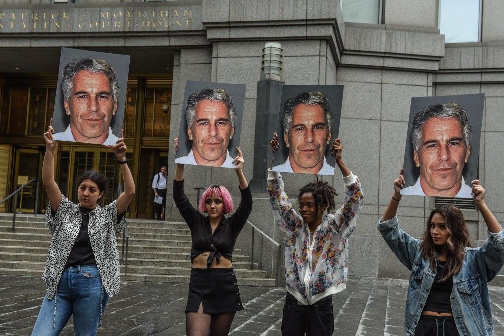 Members of a protest group called ‘Hot Mess’ hold up photos of Jeffrey Epstein in front of the federal courthouse in New York on Monday. Photo: AFP