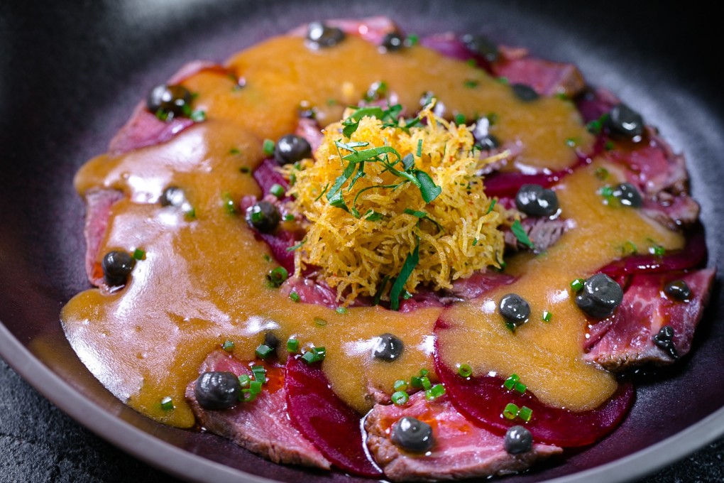 Chef Hezret-Arslan Berdiev's marble beef tataki, pickled beetroot, truffle pesto and ponzu, on the menu at his restaurant Birch in St Petersburg, Russia.