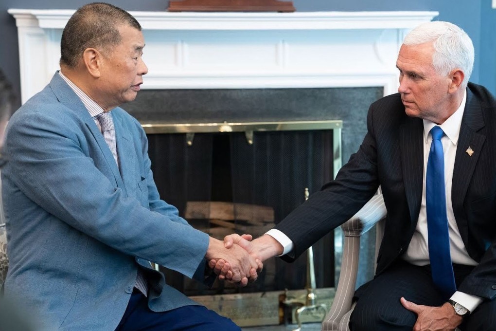 Hong Kong media mogul Jimmy Lai (left) and US Vice-President Mike Pence in the White House on Monday. Photo: Mark Simon