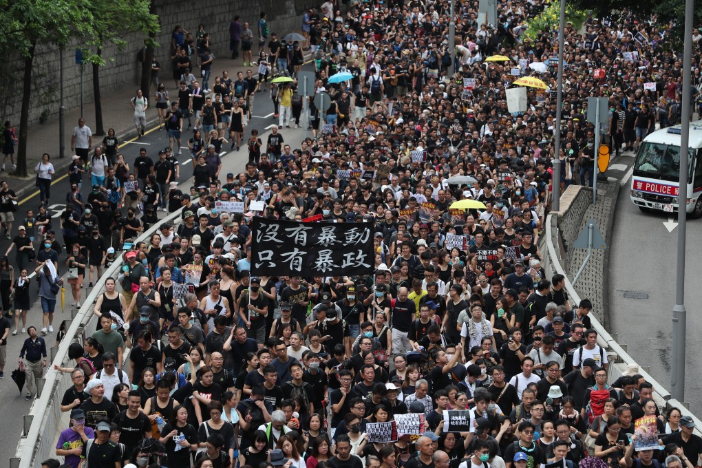 Protesters march to the West Kowloon station in Hong Kong on July 7 to protest against the city’s controversial extradition bill. Photo: Sam Tsang
