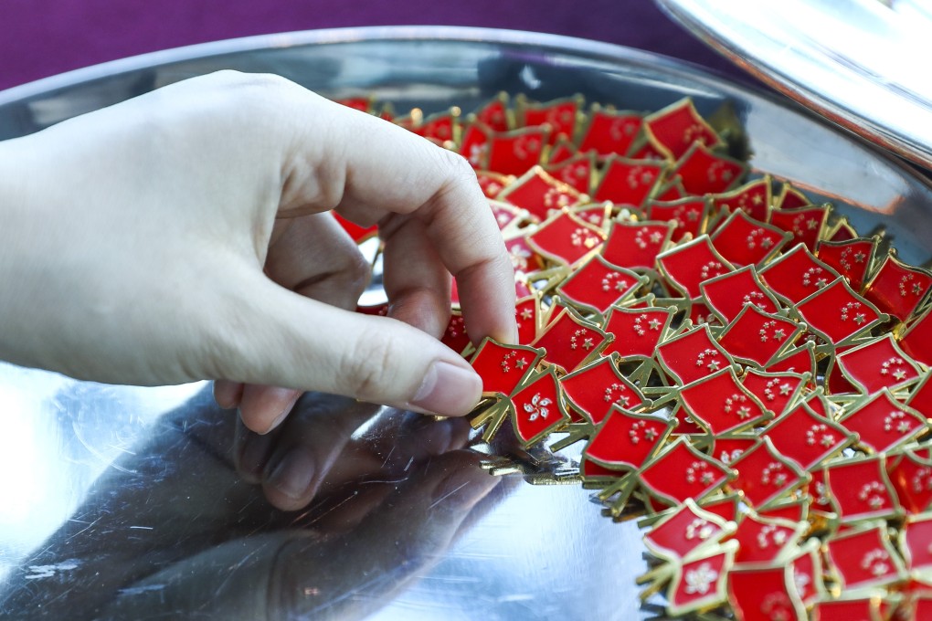 Flag pins ready for distribution during a ceremony to mark the 22nd anniversary of the return of Hong Kong’s sovereignty to mainland China, in Wan Chai on July 1. Photo: Nora Tam